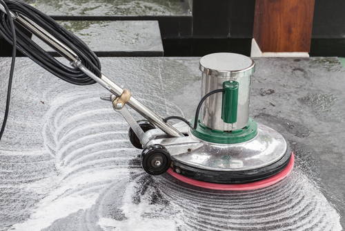 Exterior,black,stone,floor,cleaning,with,polishing,machine,and,chemical